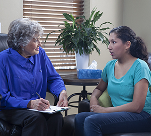 Woman talking to therapist.