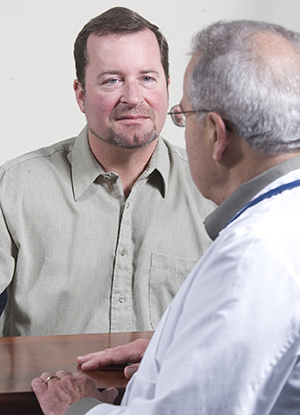 Man talking to healthcare provider.