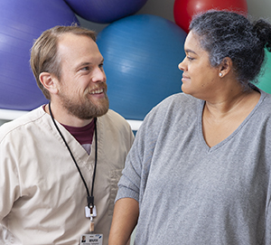 Woman talking to healthcare provider.