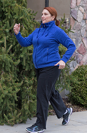 Woman walking outdoors.