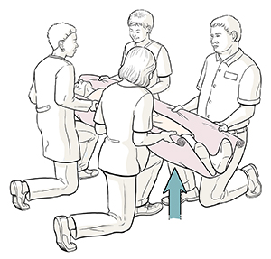 Four healthcare providers holding edges of blanket with patient inside. They are kneeling on one knee ready to lift patient.