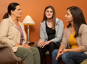 Three women in support group.